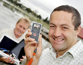Two men with gadgets