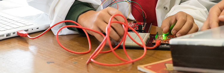 Smiling school girl in class.
