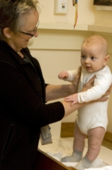 maternal health nurse checks a baby
