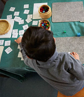 Young boy playing maths games beyond age-typical range.