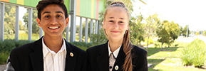 a male student and a female student smiling