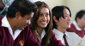 Three secondary school children sitting in the classroom