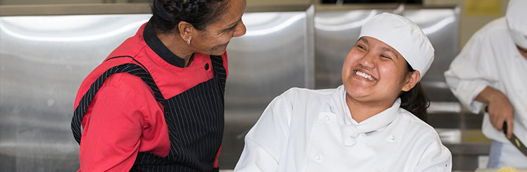 Two adults smiling.