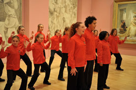 PAU - choir singing and dancing in red shirts