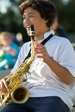 boy playing saxaphone