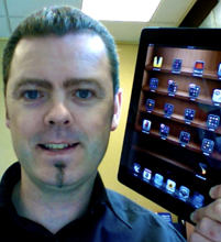 Picture of man Jonathan Nalder with iPad