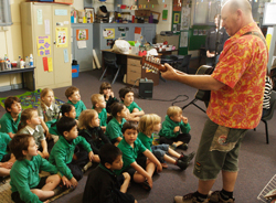 Children listening to teacher singing