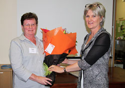 Gene Reardon presents Margaret Brown with flowers