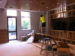 Man painting classroom