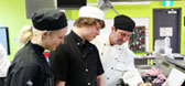 Three chefs in kitchen