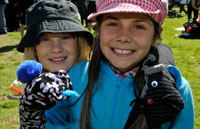 two girls showing their sock puppets