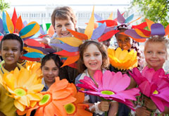 Minister Pike with children - flowers