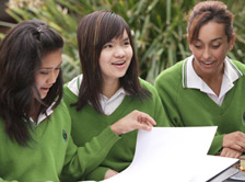Three high school girls studying