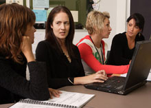 a group of adults having discussions