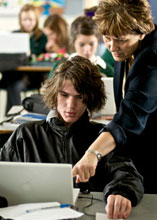 teacher helping a student