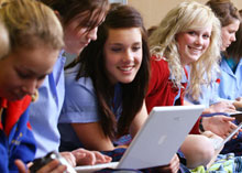 a group of students using laptops