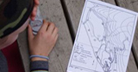 Student looks at map with compass