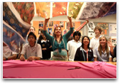 Teachers and students with sheet fabrics.