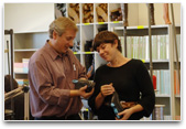 Teachers examining shoes, the materials.