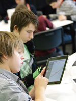 Students using iPad in classroom
