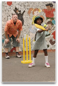Student playing cricket