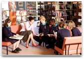 Teacher and students in a library