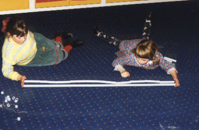 Students comparing whole pipe with 10 tenths of pipe