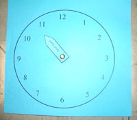 One-handed clock a bit before 11 o'clock
