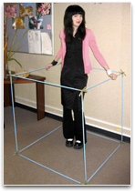 Lady standing a meter cube