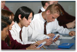 Students in class using calculators