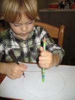 student drawing circle from fixed point on the page