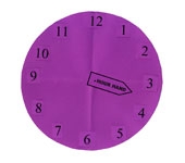 Paper cut out of clock face at about 3:17