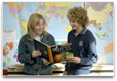 Students reading an atlas