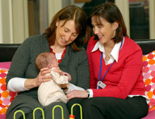 Picture of a nurse, mother and baby