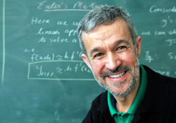 Teacher infront of blackboard
