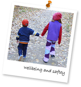 two children walking along a winter path