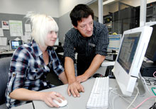 Man and Student at a Computer