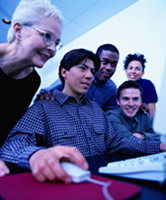 Students and Teachers at a Computer