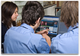 Students reading material from websites on their computers.