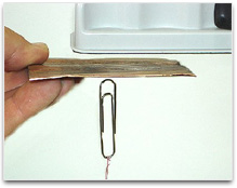 Magnet attracting a paperclip