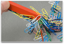 Paper clips attached to a magnet