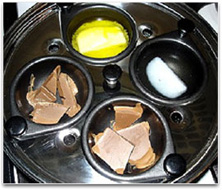 This image shows an egg poacher being used to melt four different substances.