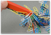 Paper clips attached to a magnet